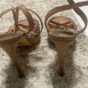 Slightly used Nine West high heel shoes. A size 8M  in champagne color.